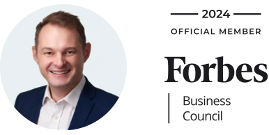 CEO Tamas Ham Szabo with Forbes member's badge
